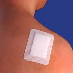 Persons back with a wound dressing